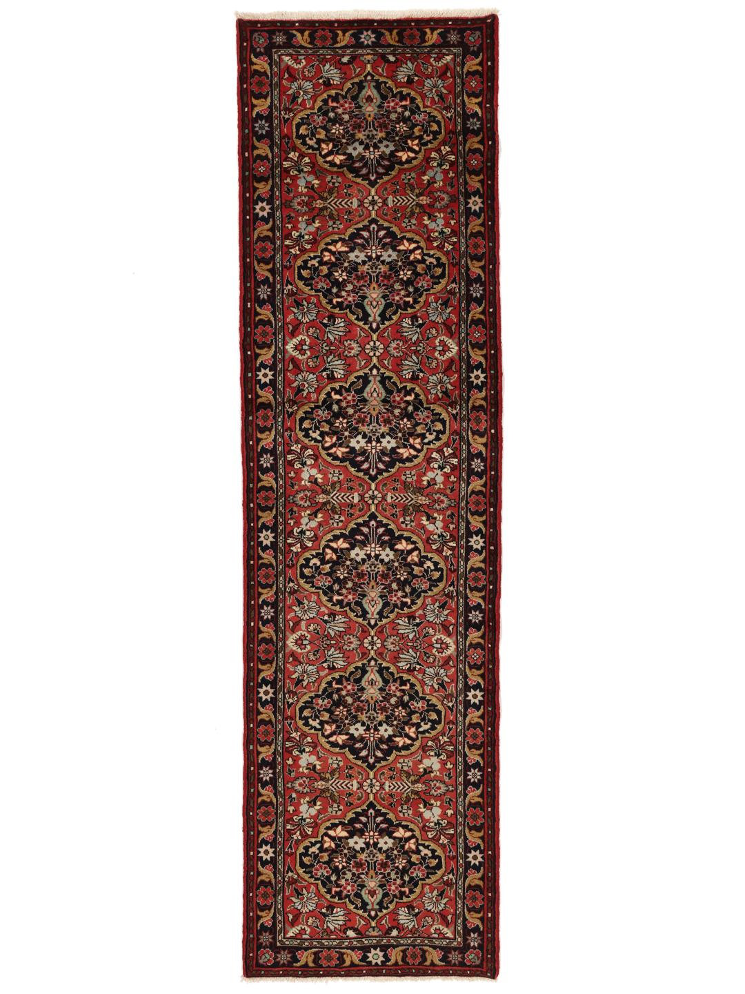 Tapis couloir Mehraban noué à la main dans des tons rouges et sombres avec des motifs floraux