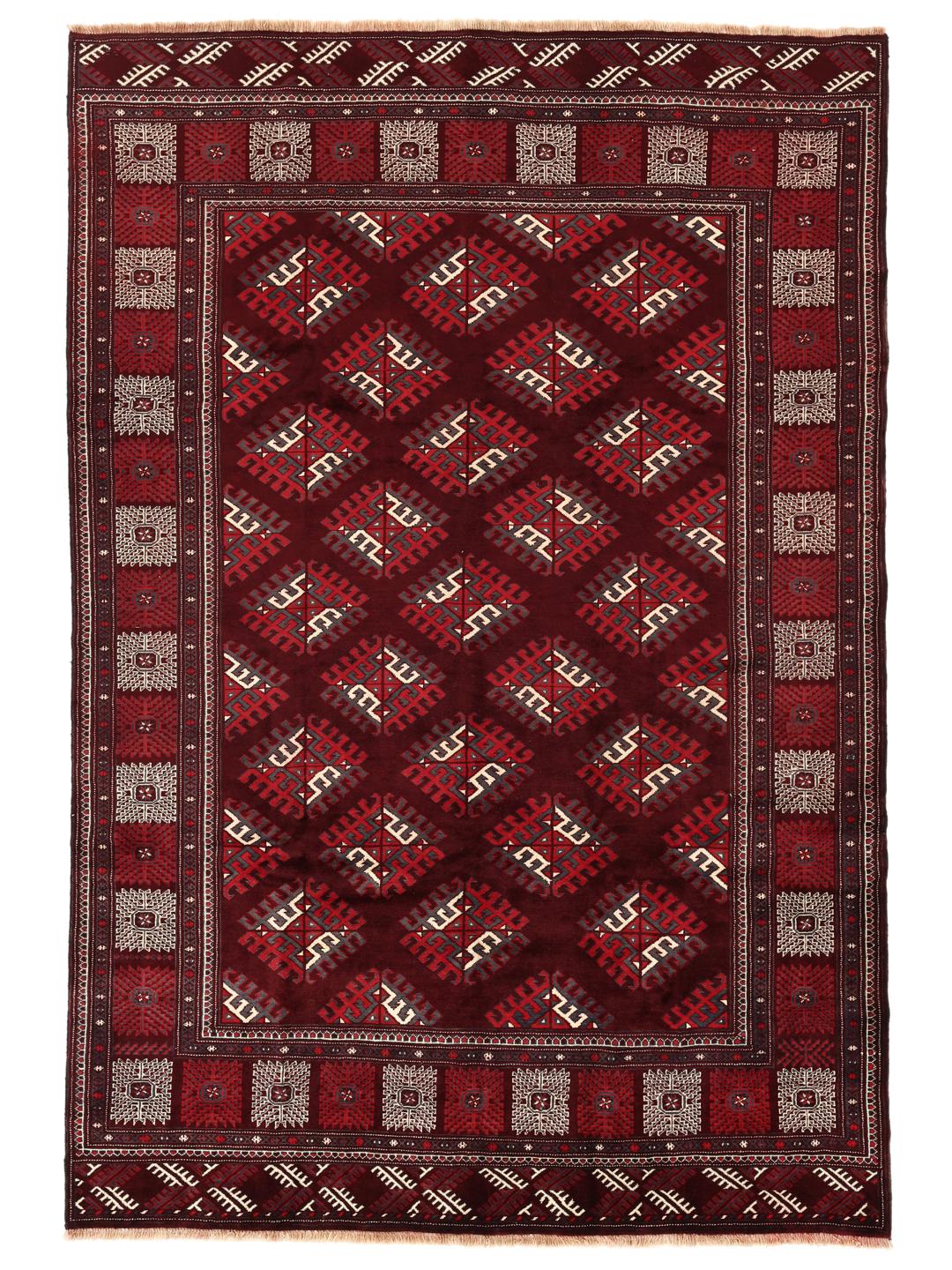 A hand-knotted Turkaman rug from the Middle East in shades of dark-red.