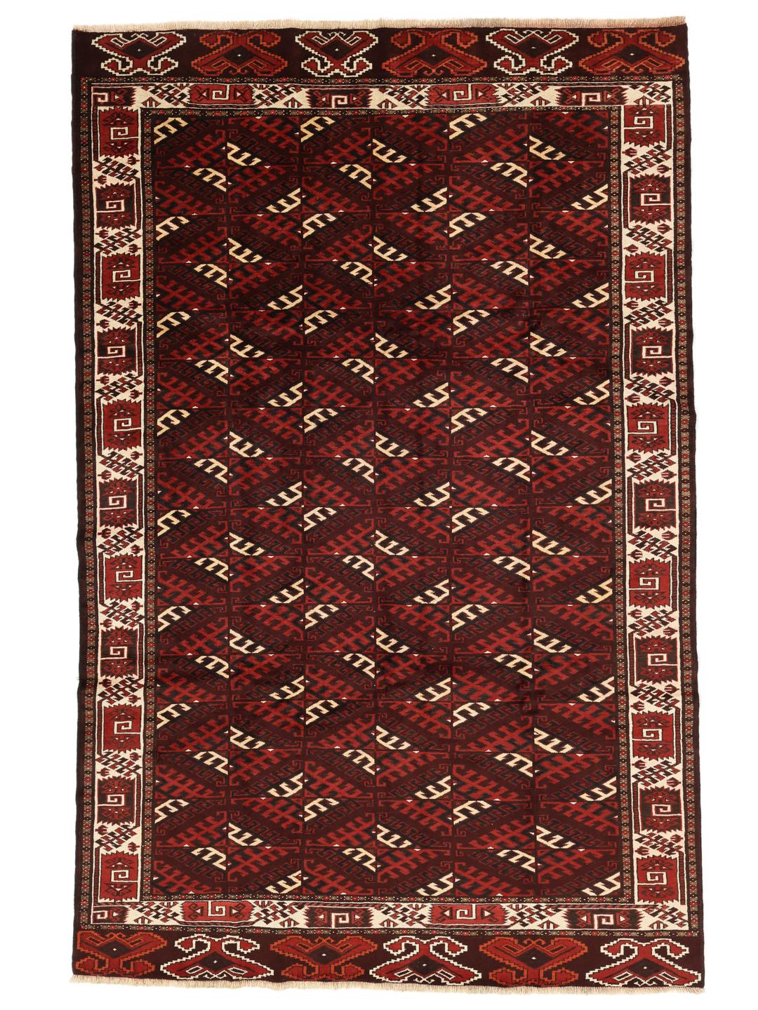 A hand-knotted Turkaman rug from the Middle East featuring a dark-red field and geometric patterns.