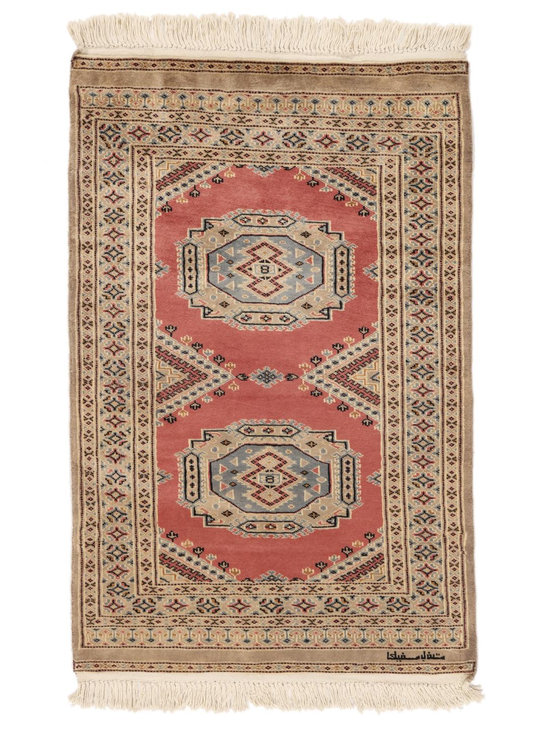 Hand-knotted Pakistan Bokhara rug with a red field and traditional medallion patterns.