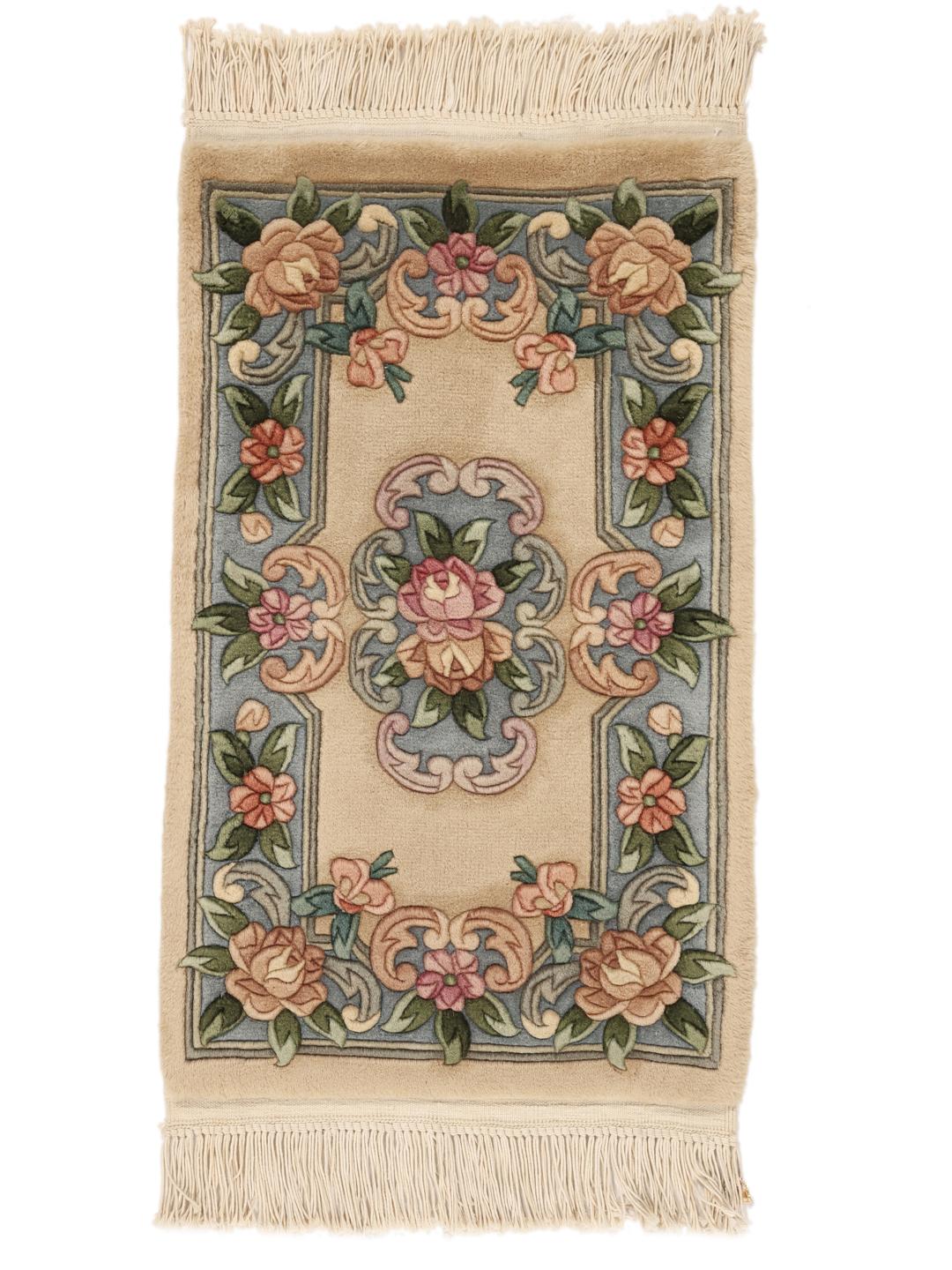 Hand-knotted floral rug from China with a beige and blue colour palette