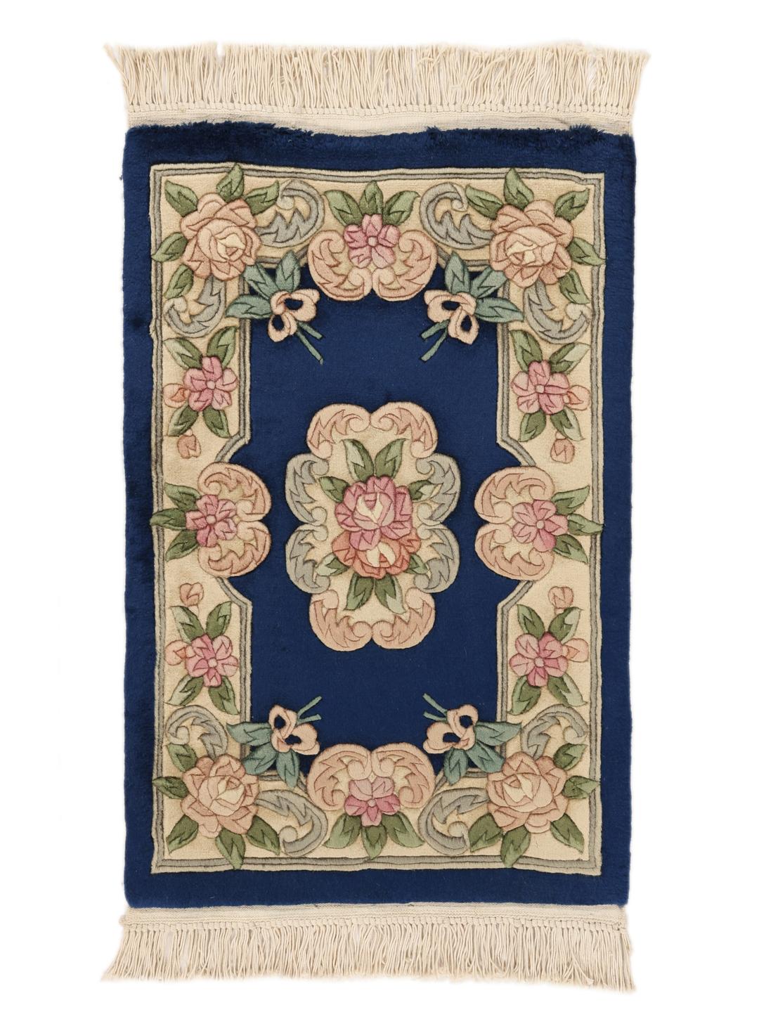 Hand-knotted Chinese rug with floral motifs on a deep blue background
