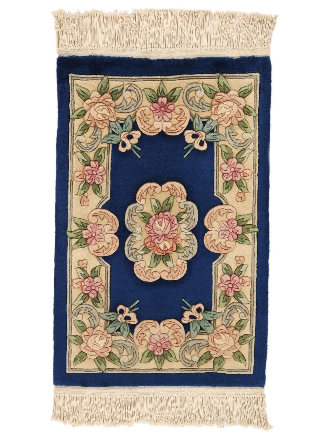 Hand-knotted Chinese rug with floral motifs on a deep blue background