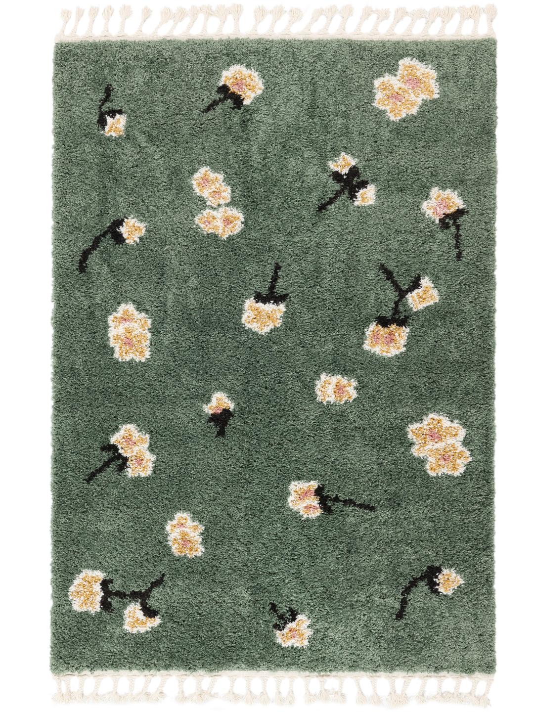 grønt tæppe med blomstermotiver og fringe