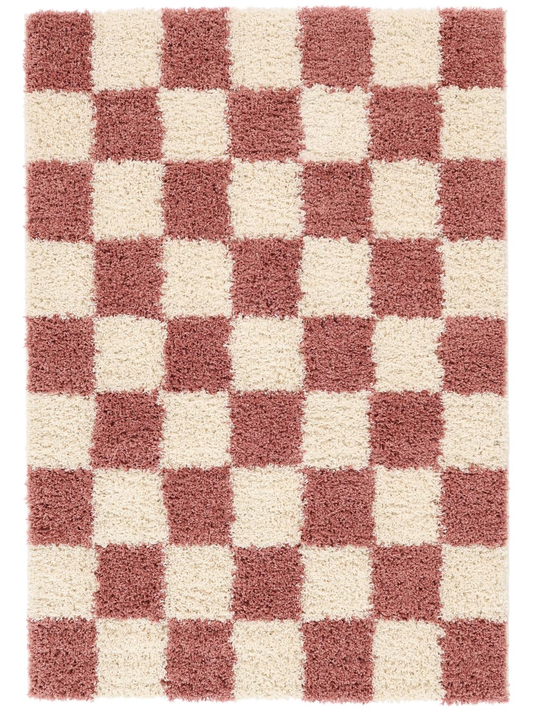 tapis rose et blanc à texture épaisse