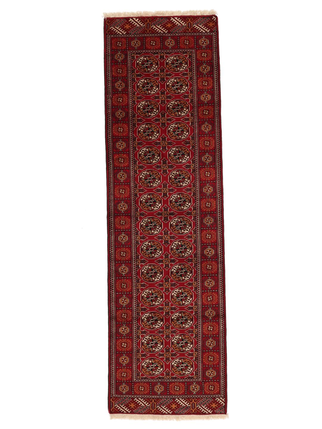 Hand-knotted red Turkaman runner with intricate geometric patterns