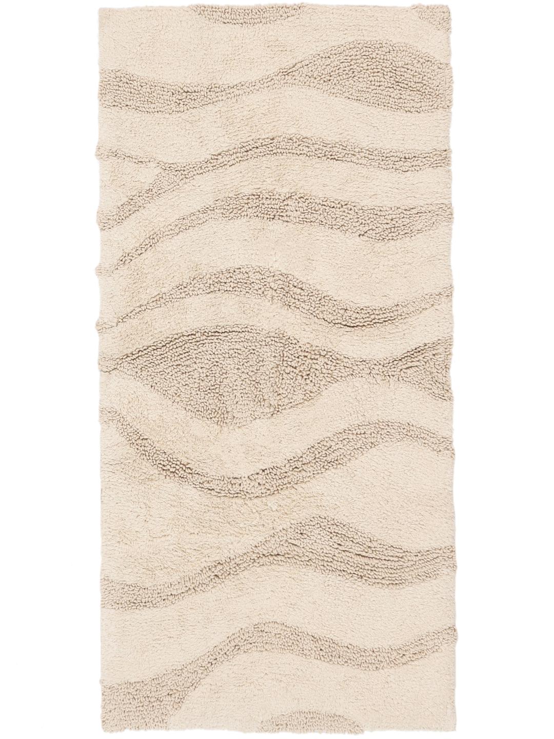 Beige bademåtte med et tekstureret bølget stribemønster