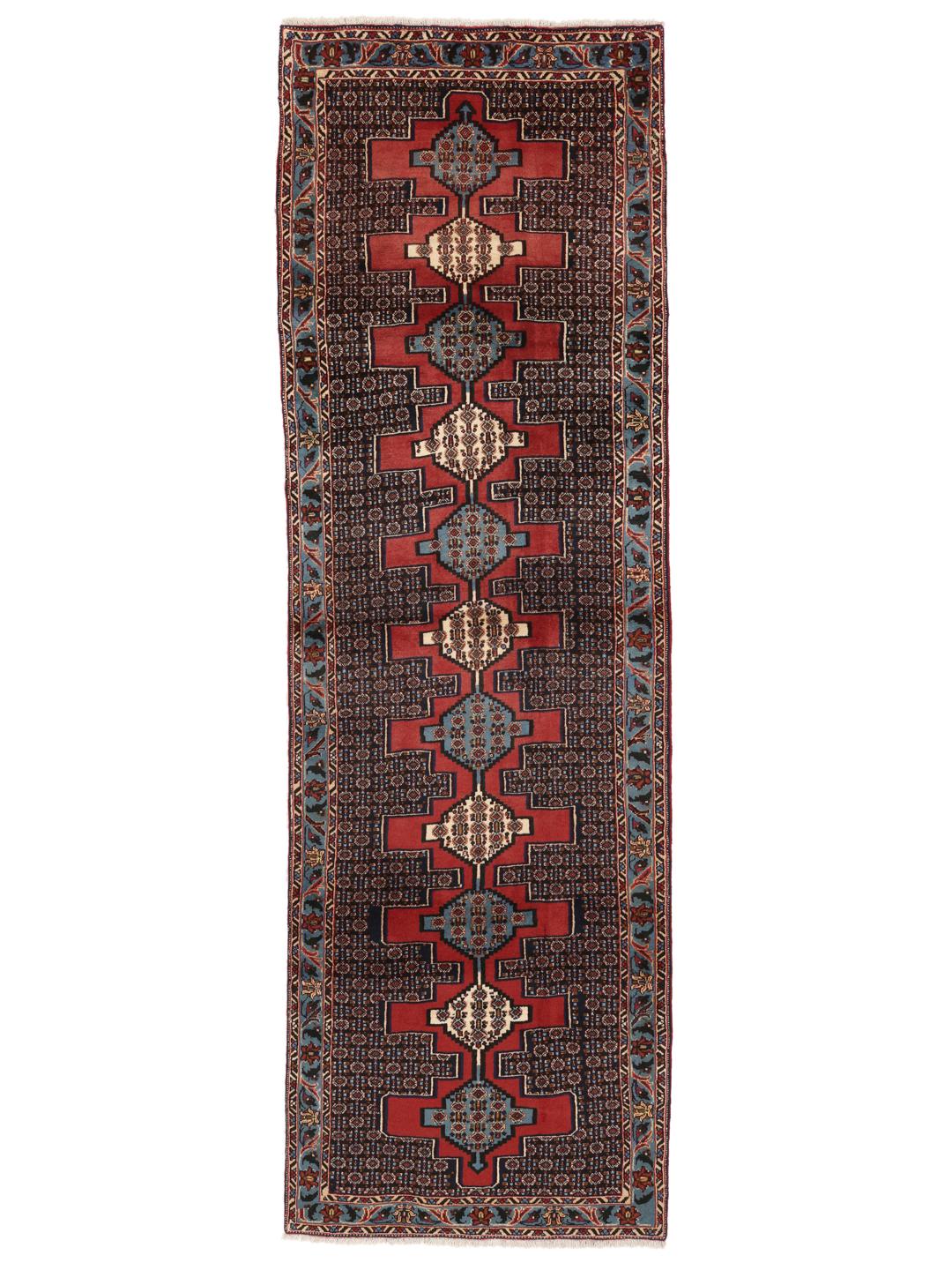 Hand-knotted Senneh runner with a geometric pattern in red and blue tones from the Middle East