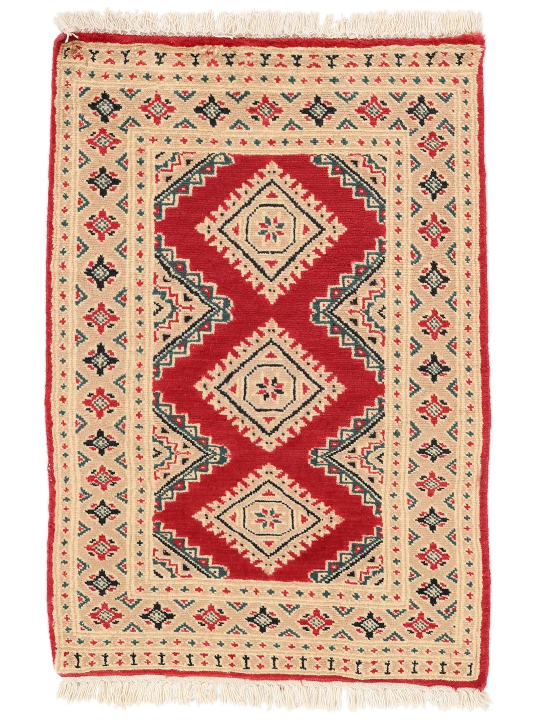 A hand-knotted Pakistan Bokhara rug in red and beige with geometric medallions