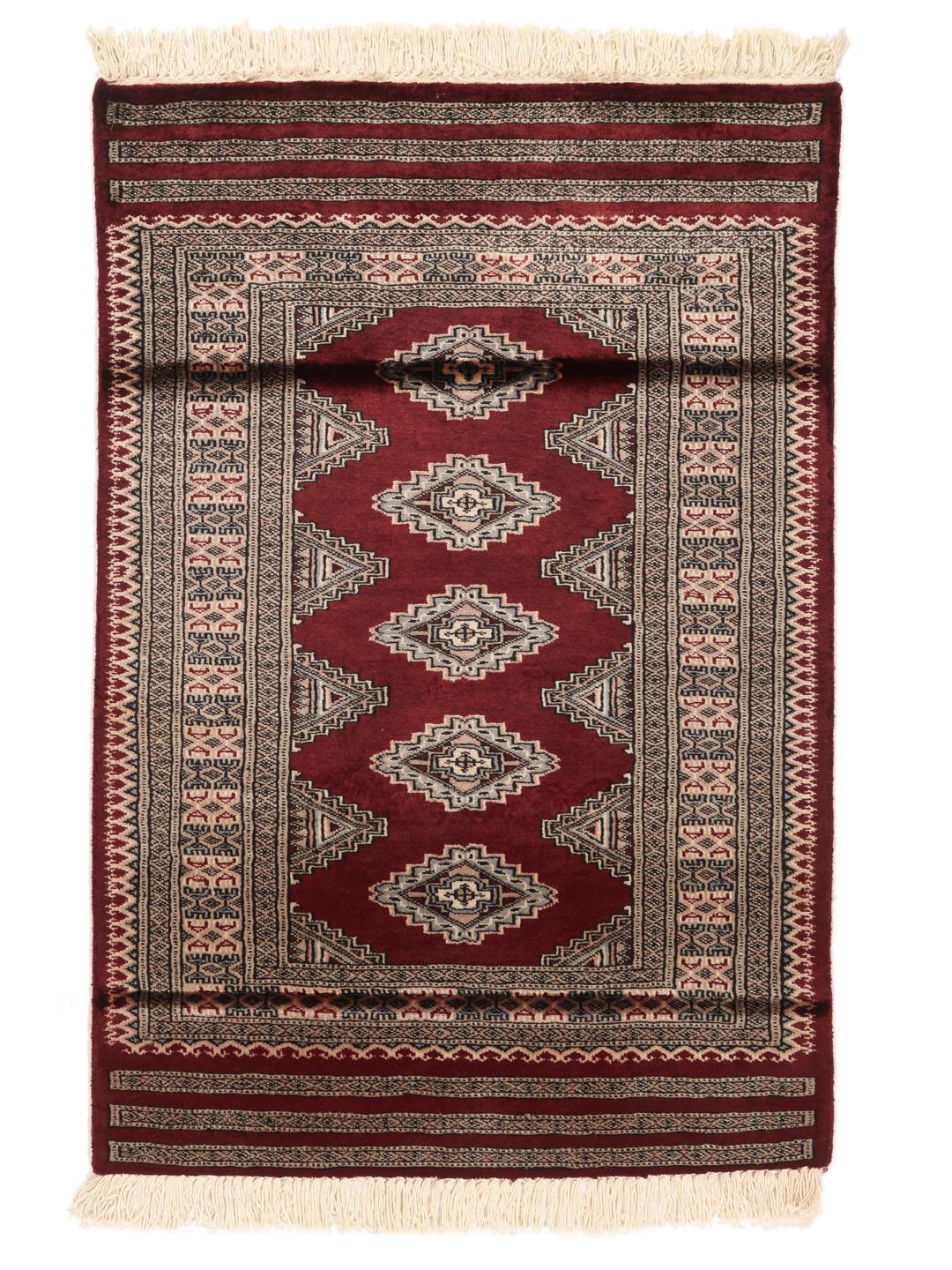 A hand-knotted Pakistan Bokhara rug featuring geometric medallions in dark-red and beige.