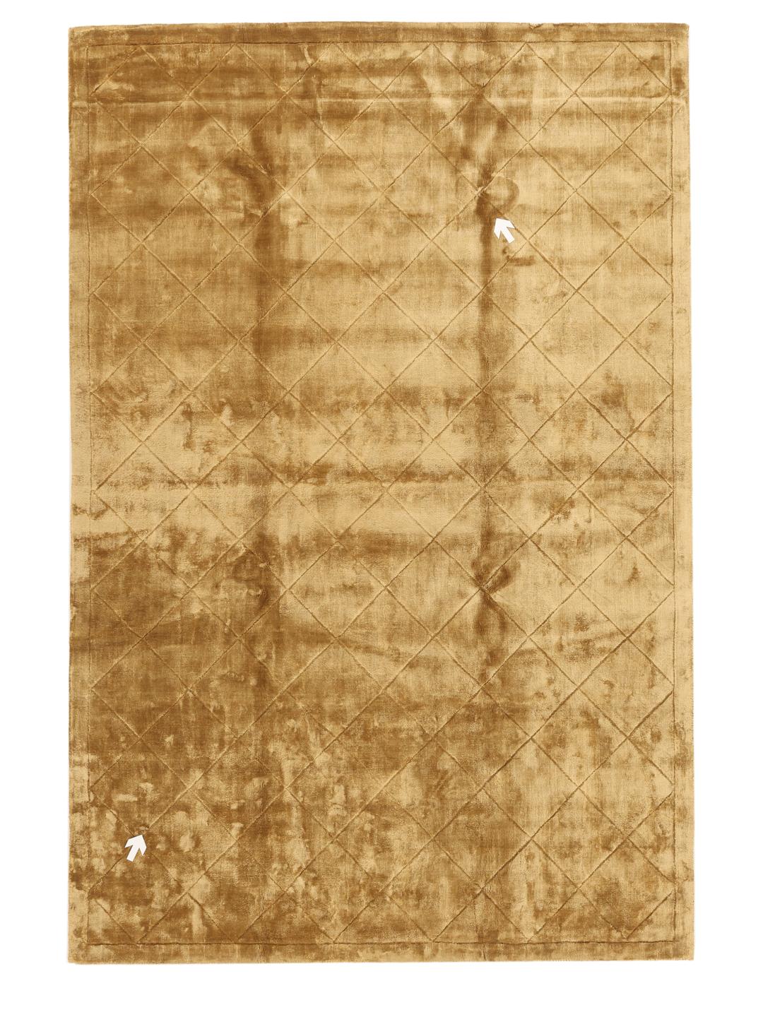 A brown rug with a diamond pattern in a warm golden tone.