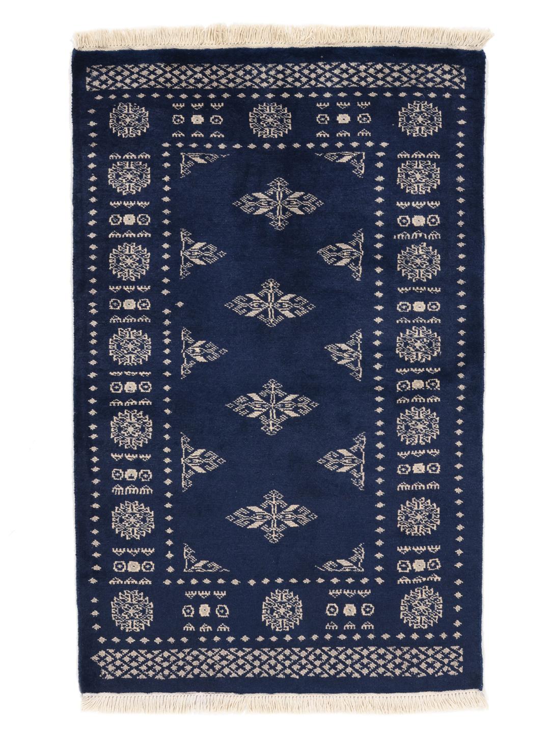 Hand-knotted Pakistan Bokhara rug with a deep blue field and intricate light-toned motifs