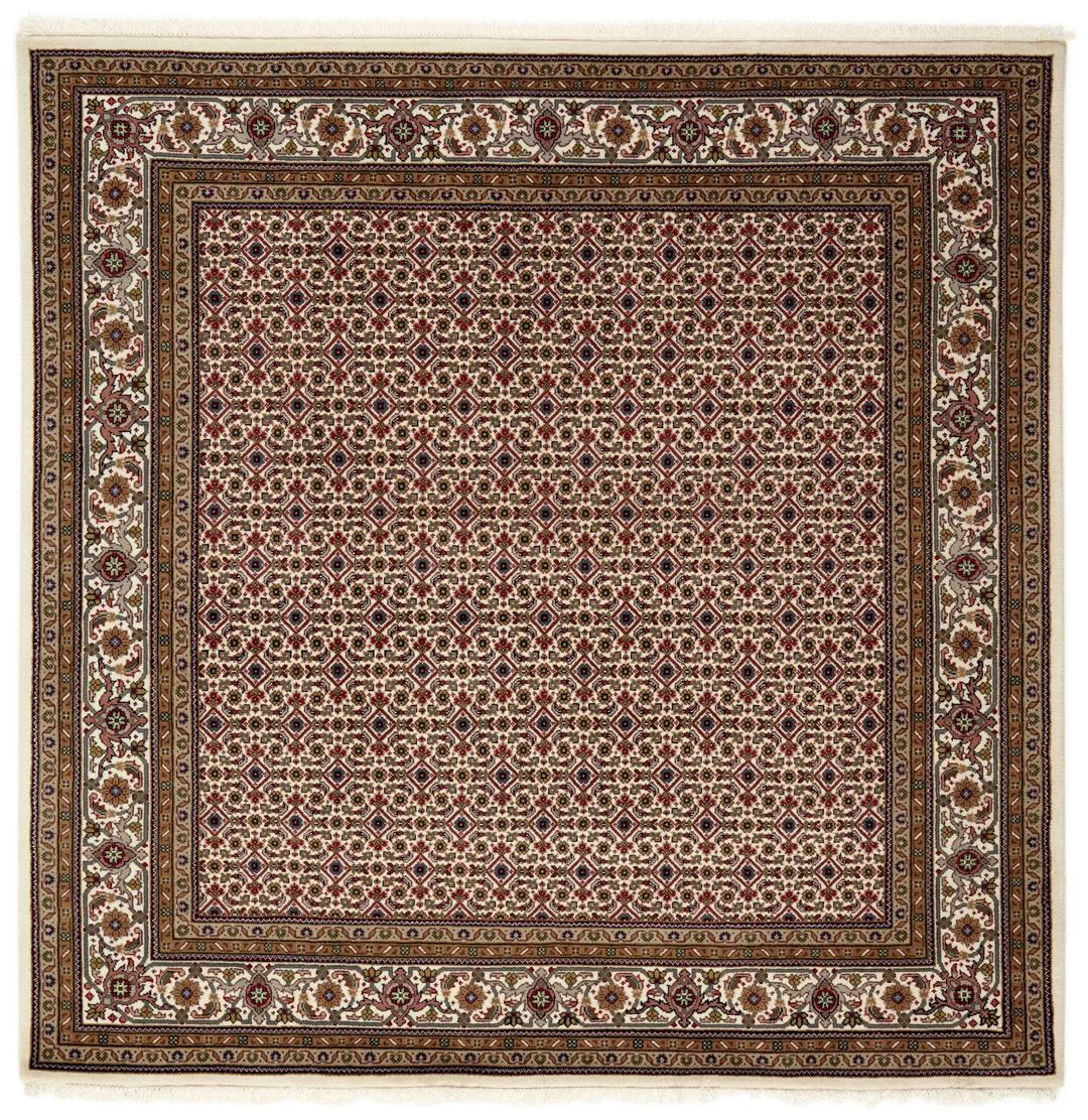 Kvadratisk håndknyttet Tabriz-tæppe fra Indien i beige og røde toner.