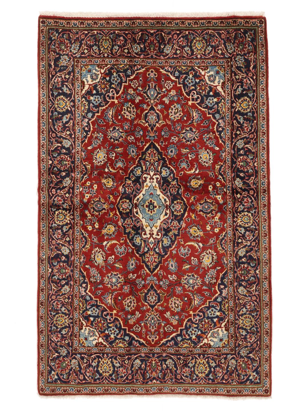 Hand-knotted Keshan rug from the Middle East in shades of red and blue.