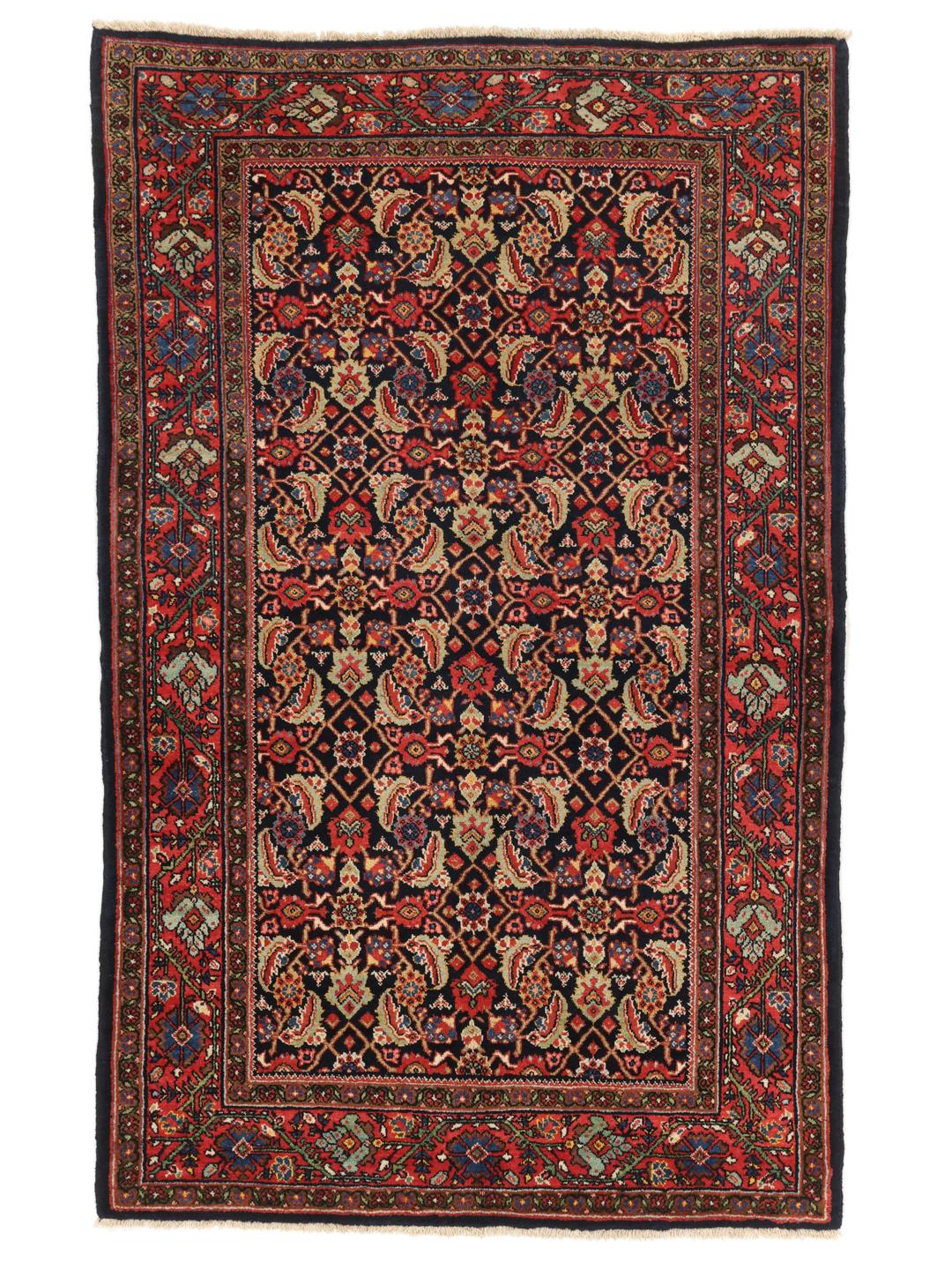 Hand-knotted Sarouk rug from the Middle East in dark-red and blue tones.
