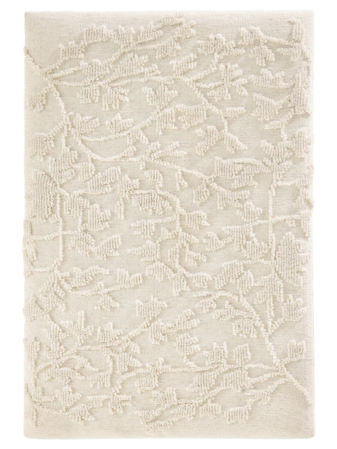 Witte wanddecoratie met een bladpatroon