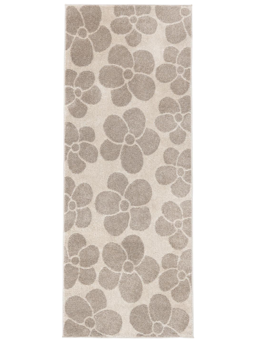 Een beige loper met een herhalend bloemmotief