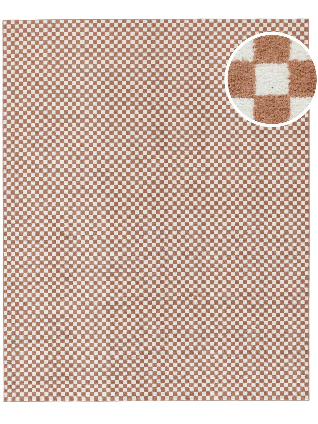 A rectangular rug with a terracotta and white checkerboard pattern.