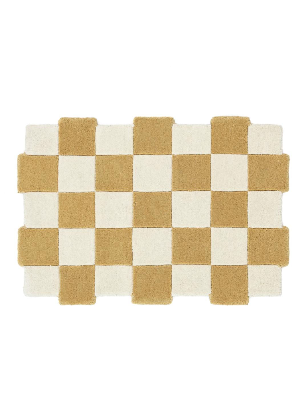 Geel en wit tapijt met een onregelmatige vorm