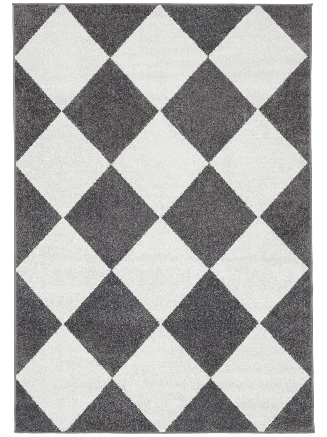 Tapis blanc et gris avec un motif de losanges
