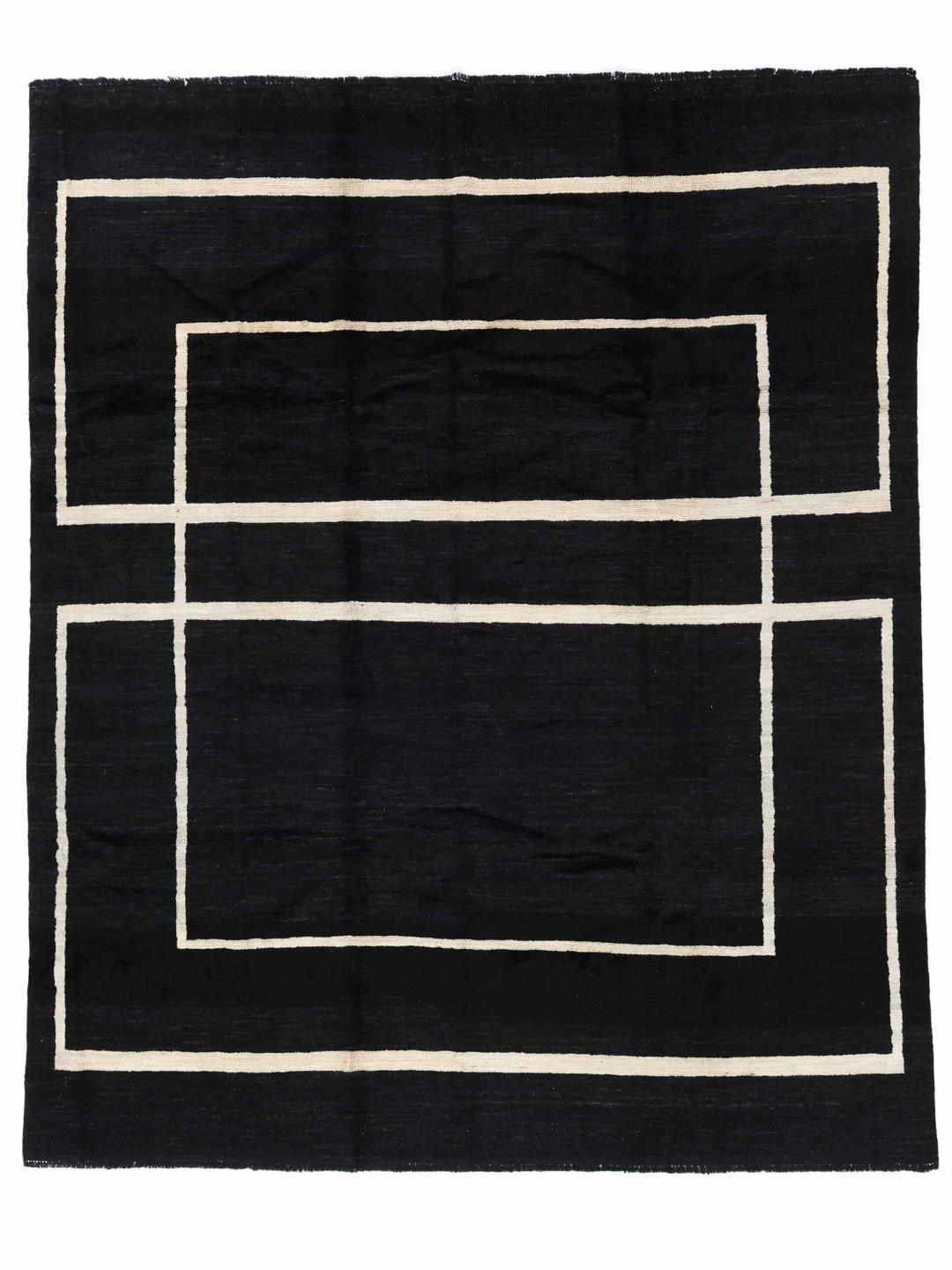 Een handgeknoopt Afghaans Gabbeh Modern vloerkleed in zwart en wit met een geometrisch vierkant patroon.