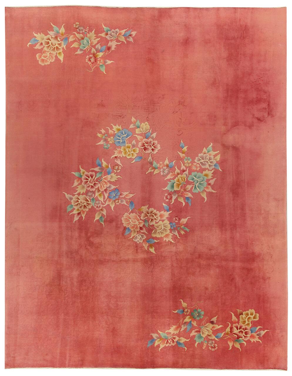 Antique Chinese Art Deco rug with floral motifs on a red background