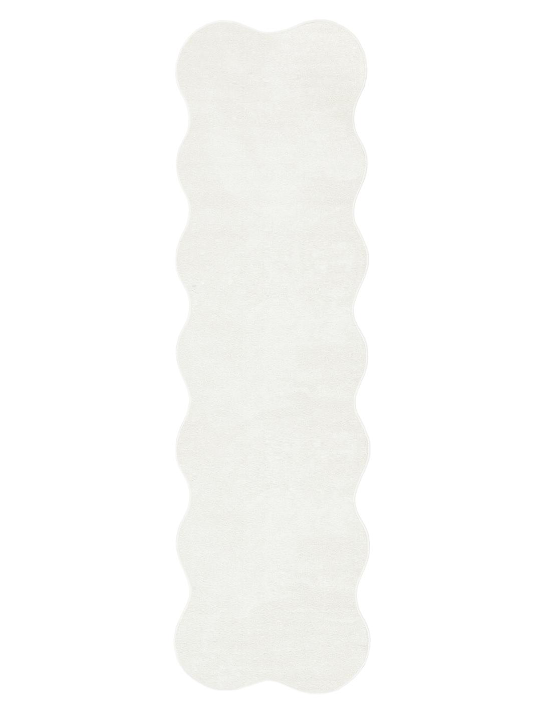 Tapis blanc de forme irrégulière et ondulée