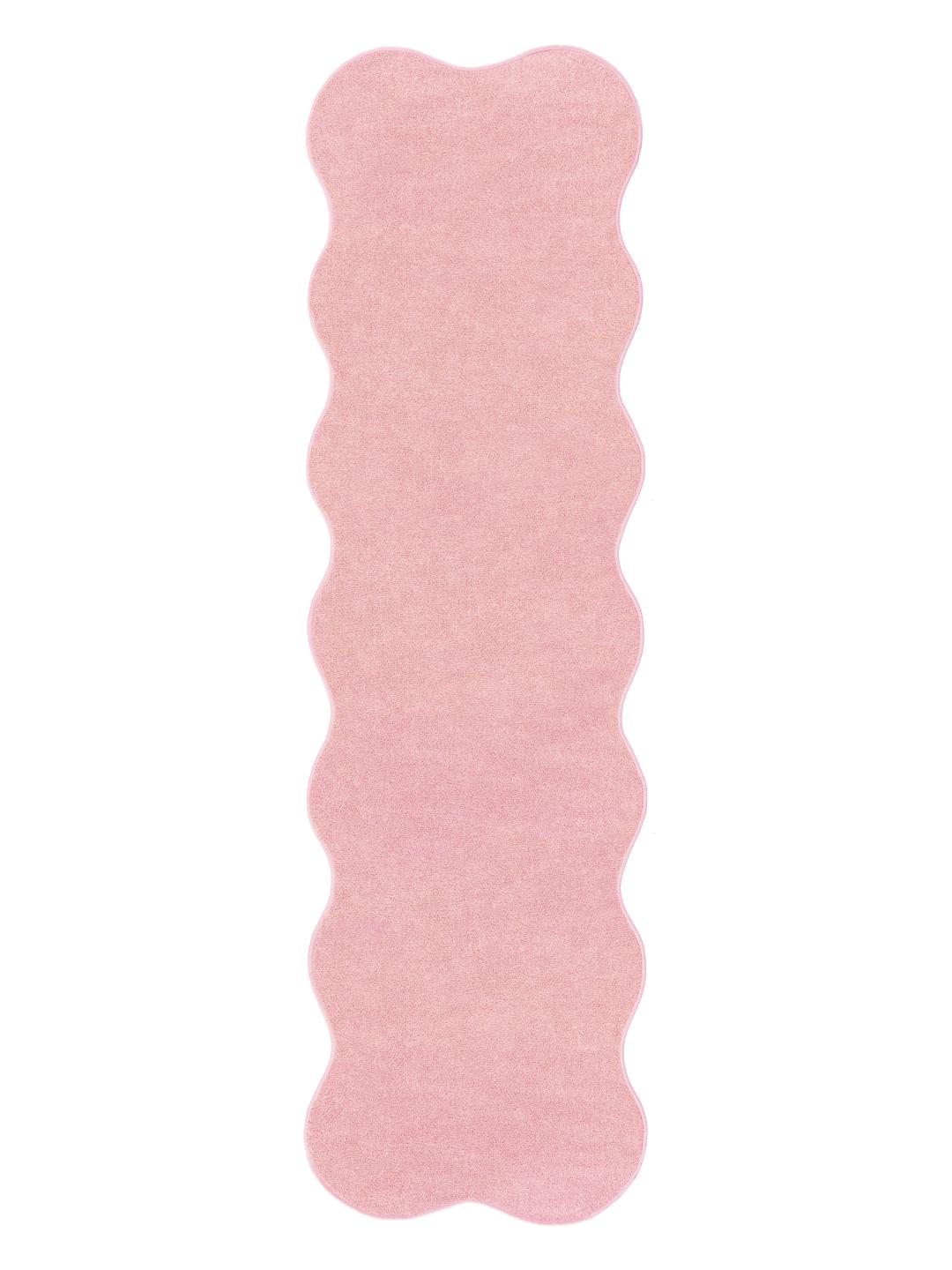 Roze vloerkleed met een onregelmatige golvende vorm