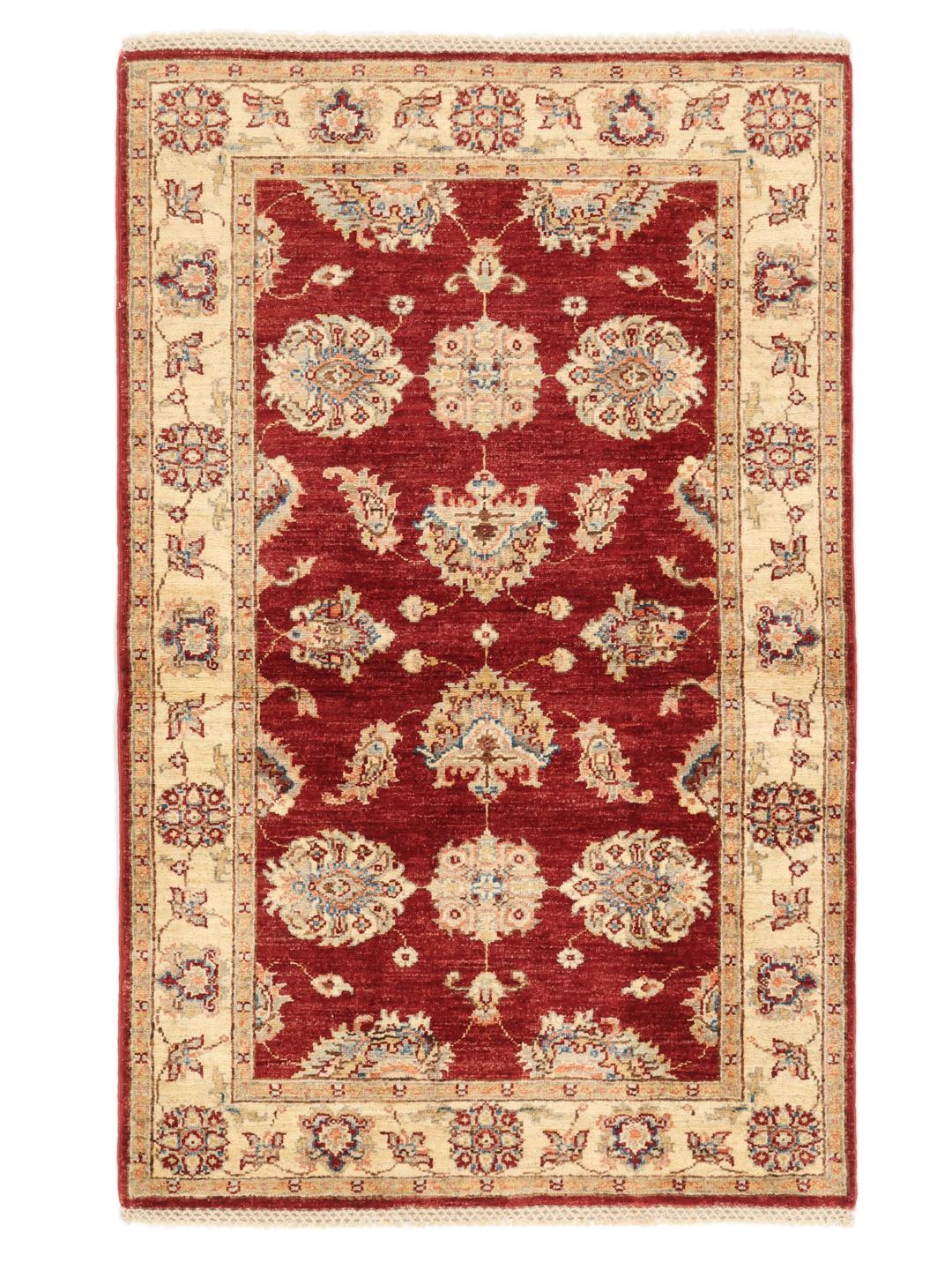 Hand-knotted Afghan rug with a red field and traditional floral patterns