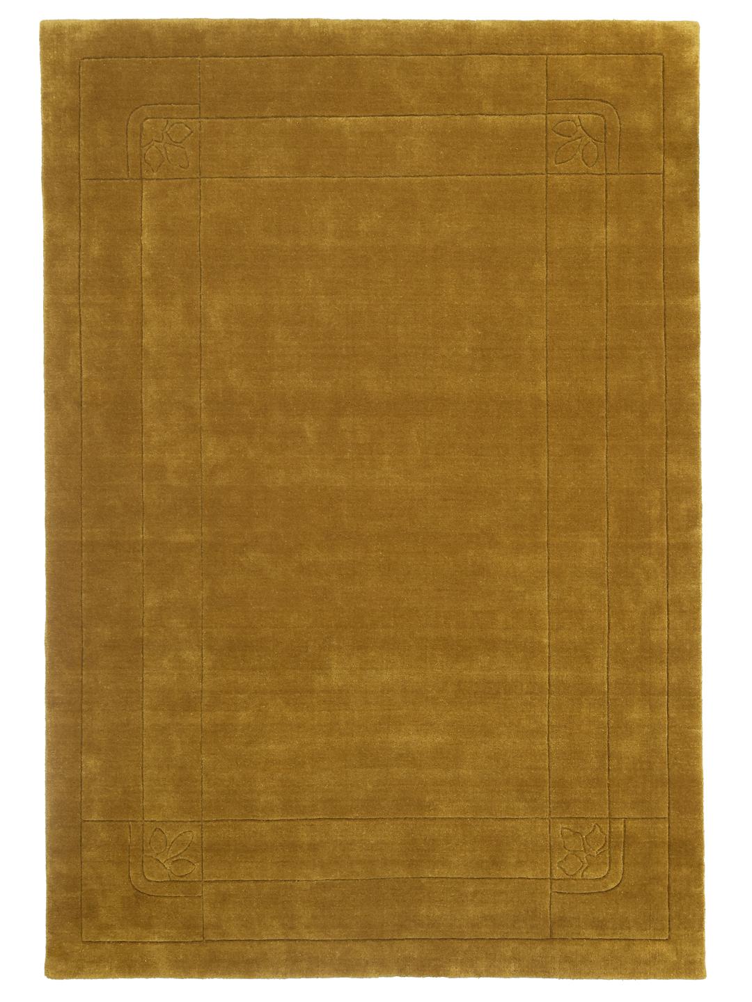 Goudkleurig vloerkleed met een decoratieve rand