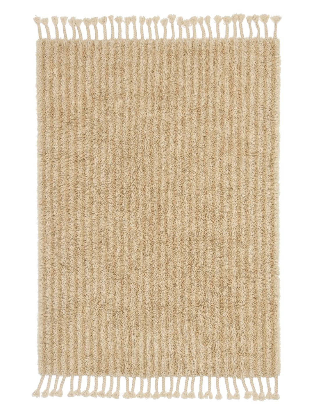 Beige tæppe med riflet tekstur og frynser