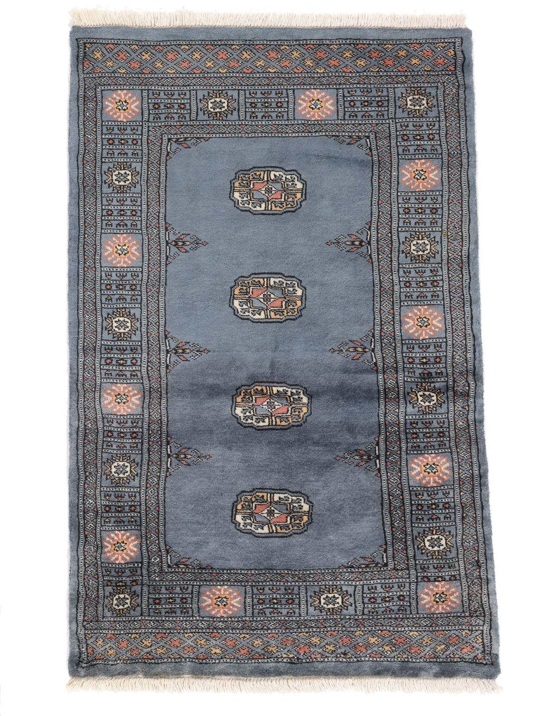 Hand-knotted blue Pakistan Bokhara rug with traditional medallion patterns