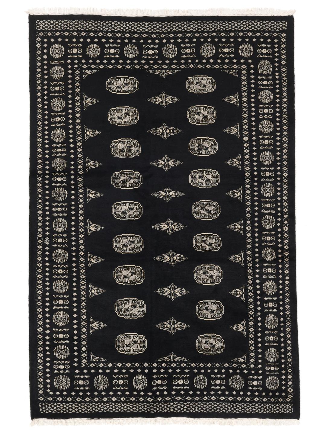 A hand-knotted Pakistan Bokhara rug in black with detailed geometric motifs.