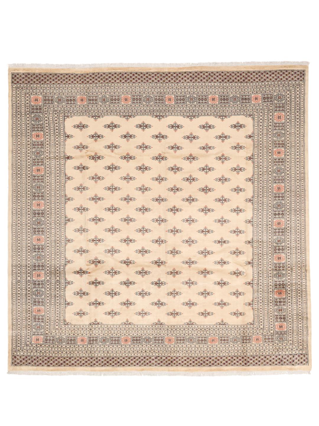 Handgeknoopt beige wollen tapijt uit Pakistan met traditionele patronen