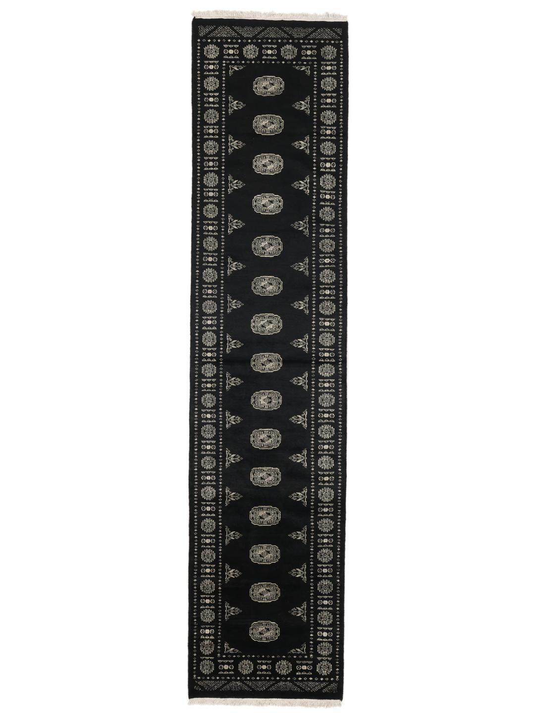 A hand-knotted Pakistan Bokhara runner featuring a black field with geometric motifs