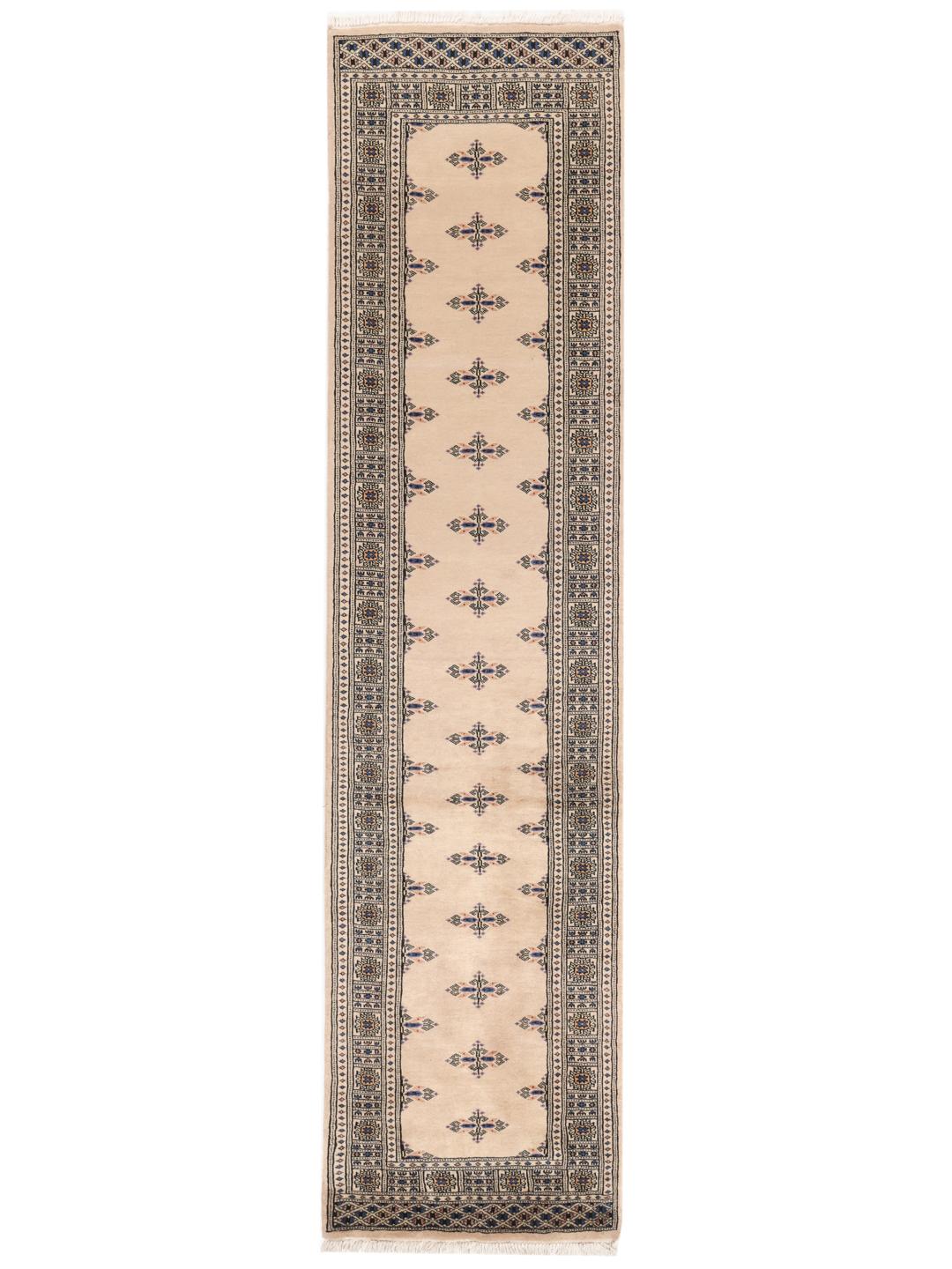 Hand-knotted beige runner rug from Pakistan with traditional motifs