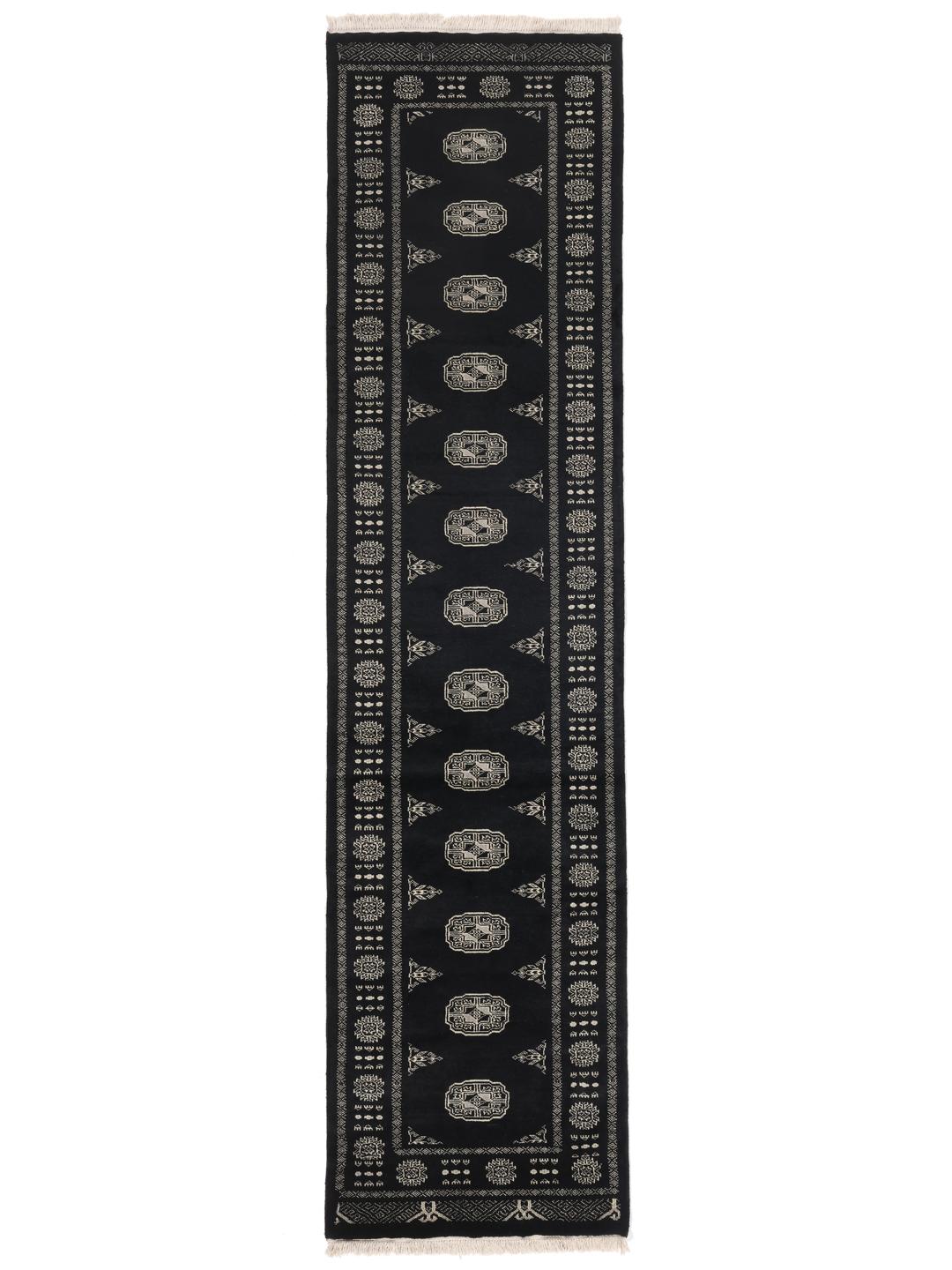 Hand-knotted black runner from Pakistan with traditional geometric patterns