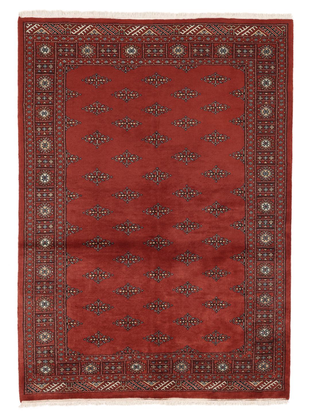 A hand-knotted Pakistan Bokhara rug in deep red with repeating geometric motifs.