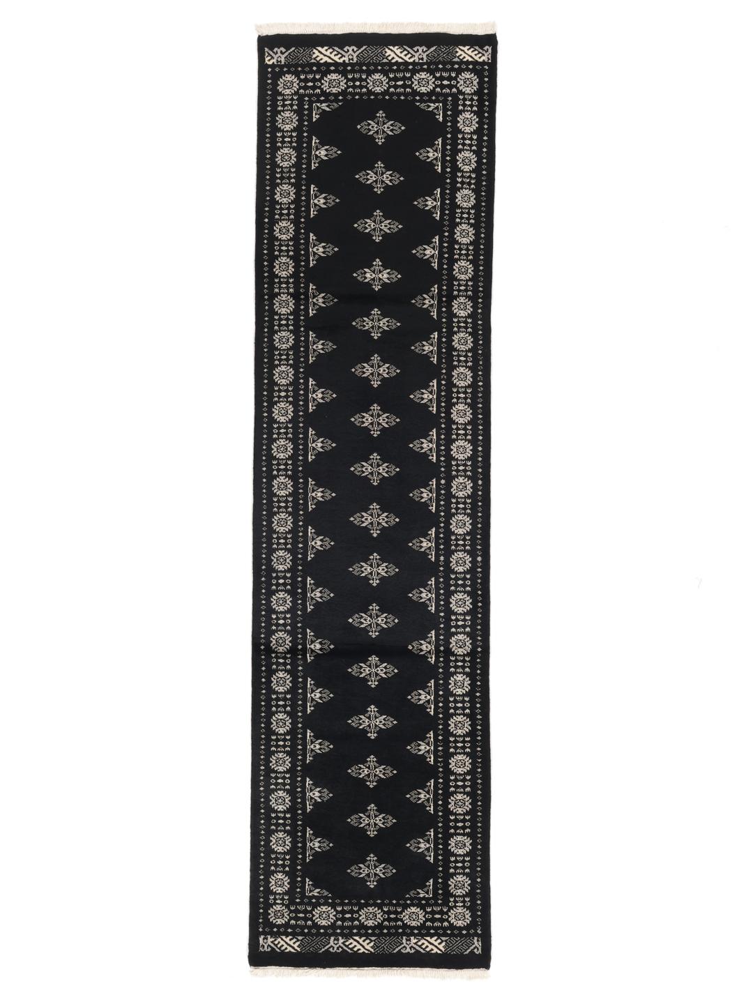 Hand-knotted black runner rug from Pakistan with ivory geometric motifs