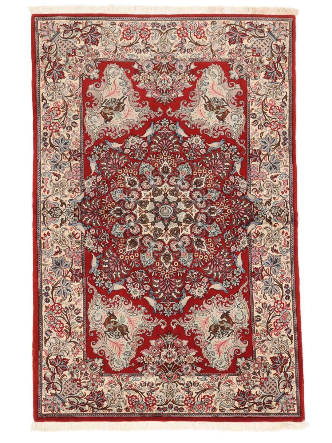 A hand-knotted Sarough rug from the Middle East featuring a red field with floral patterns.