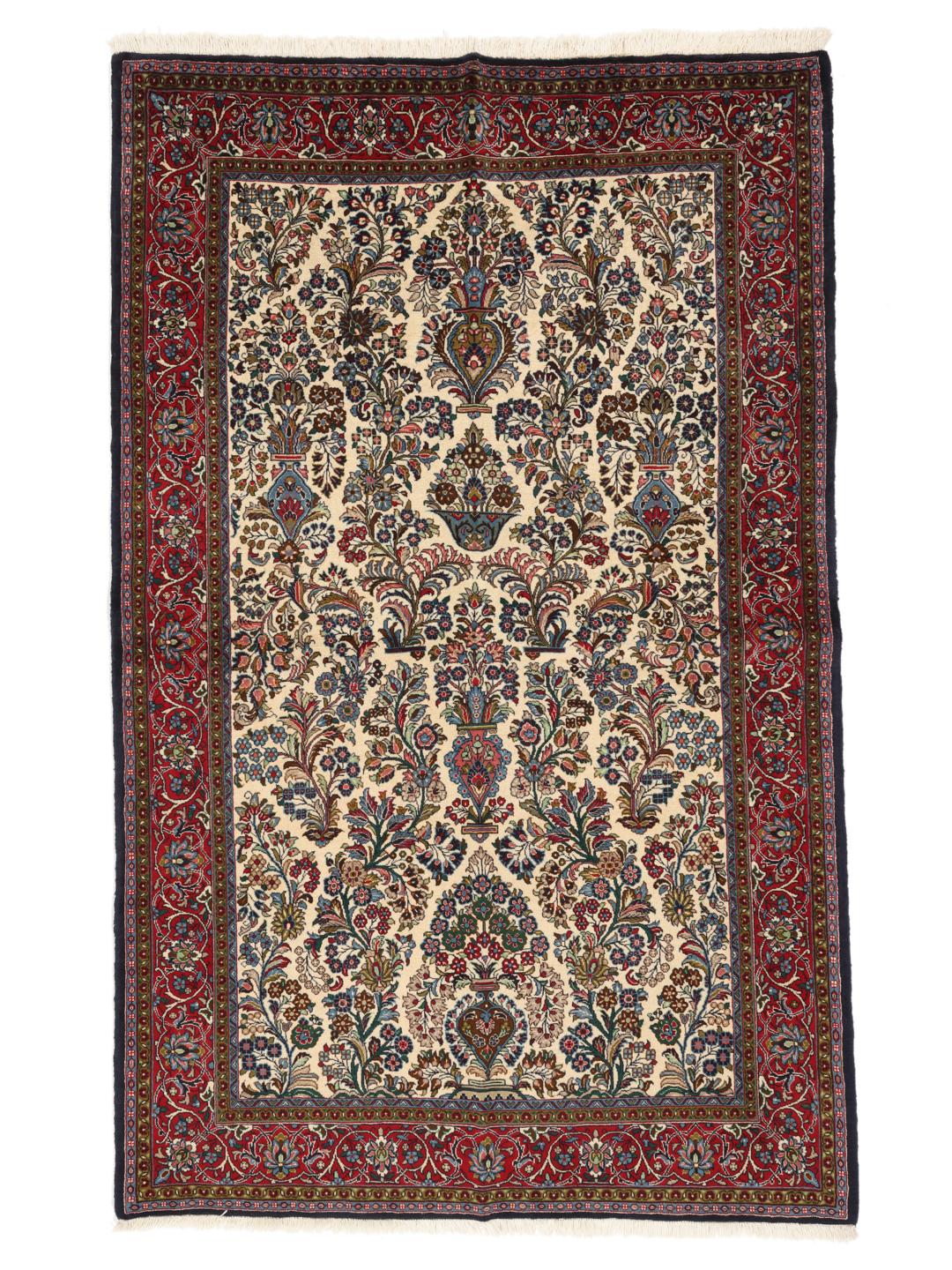 Hand-knotted Sarough rug from the Middle East with a floral pattern in red and beige.