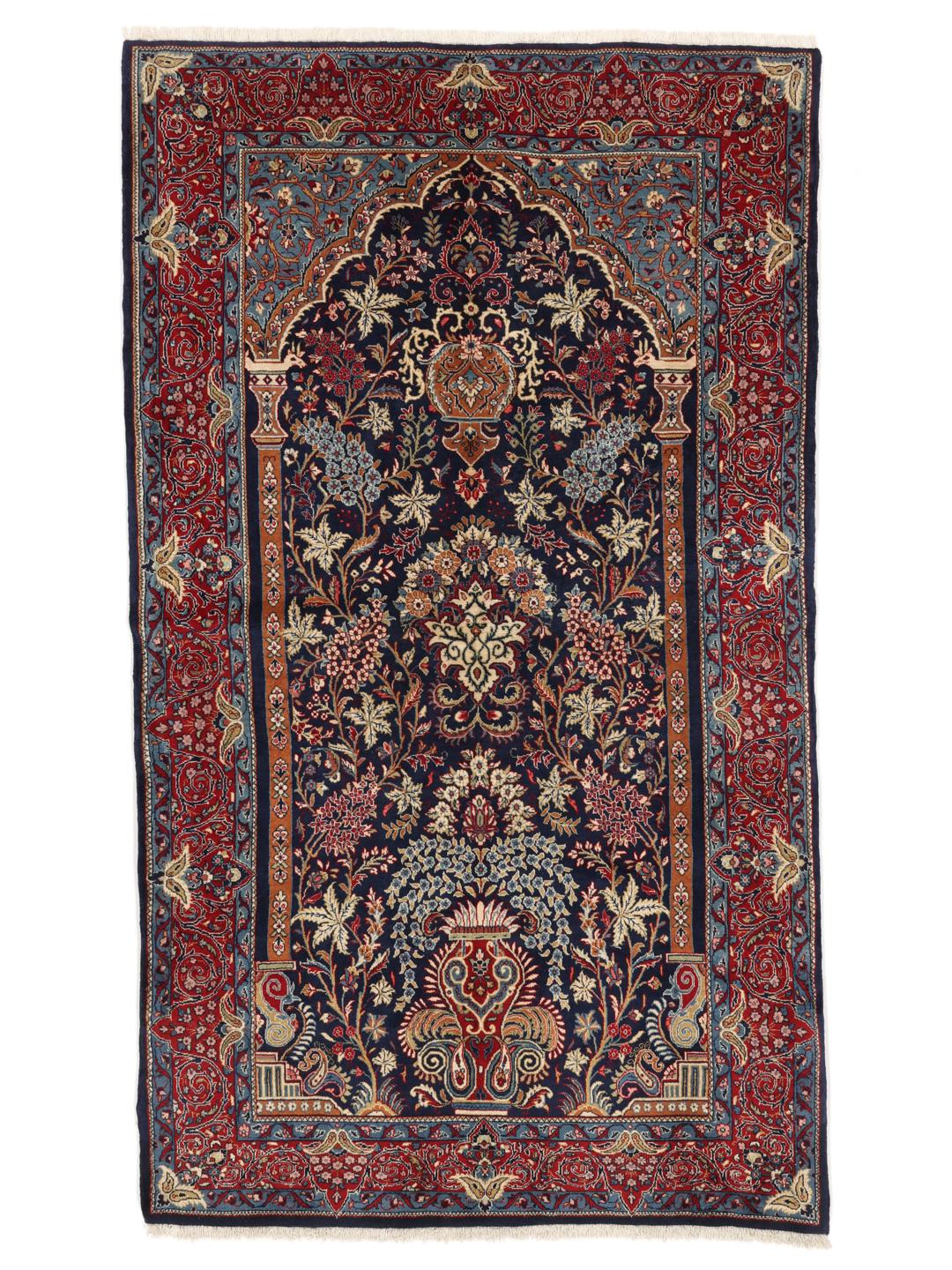 Hand-knotted Sarough rug featuring a traditional floral mihrab design in deep blue and red tones.