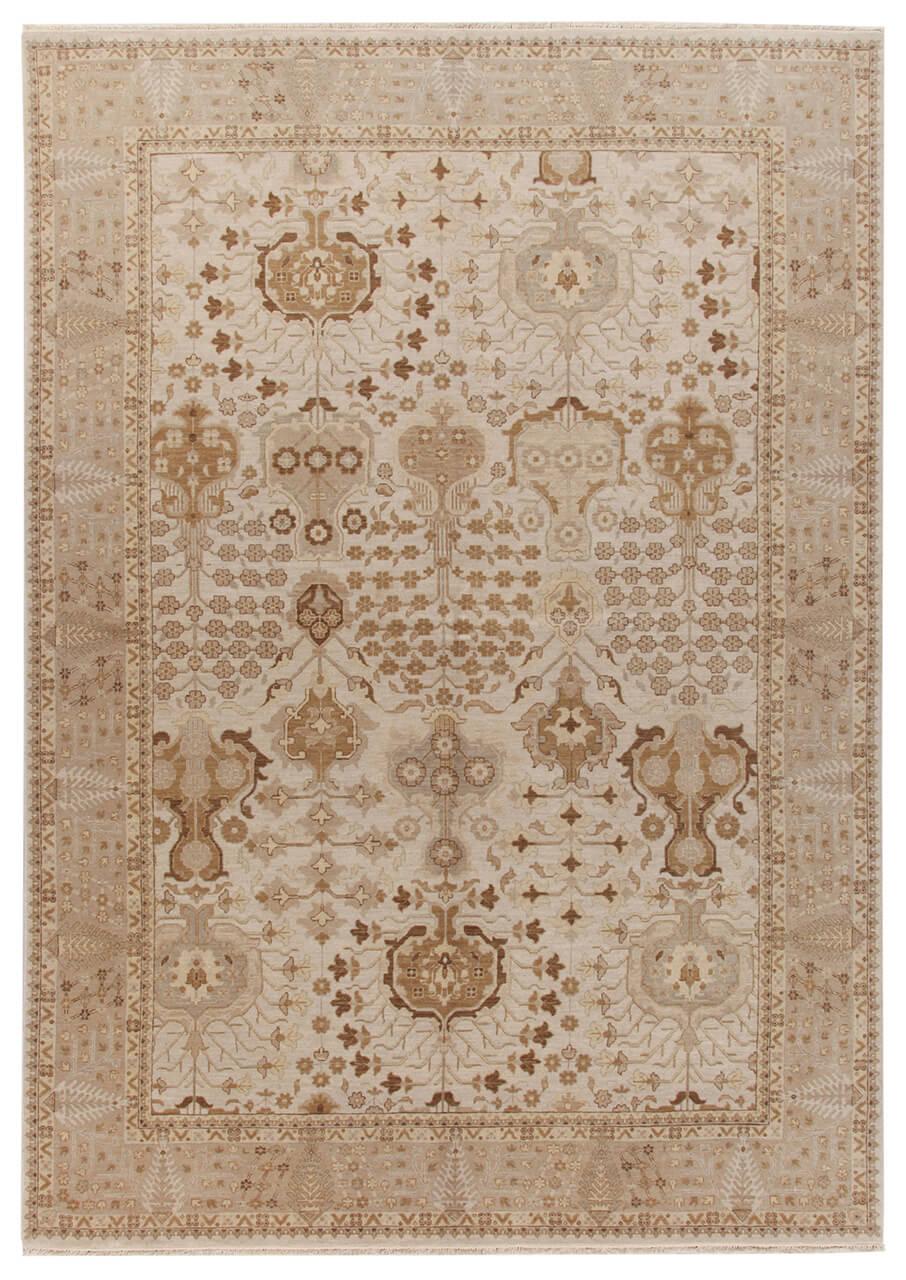 Een handgeknoopt beige bloementapijt uit India
