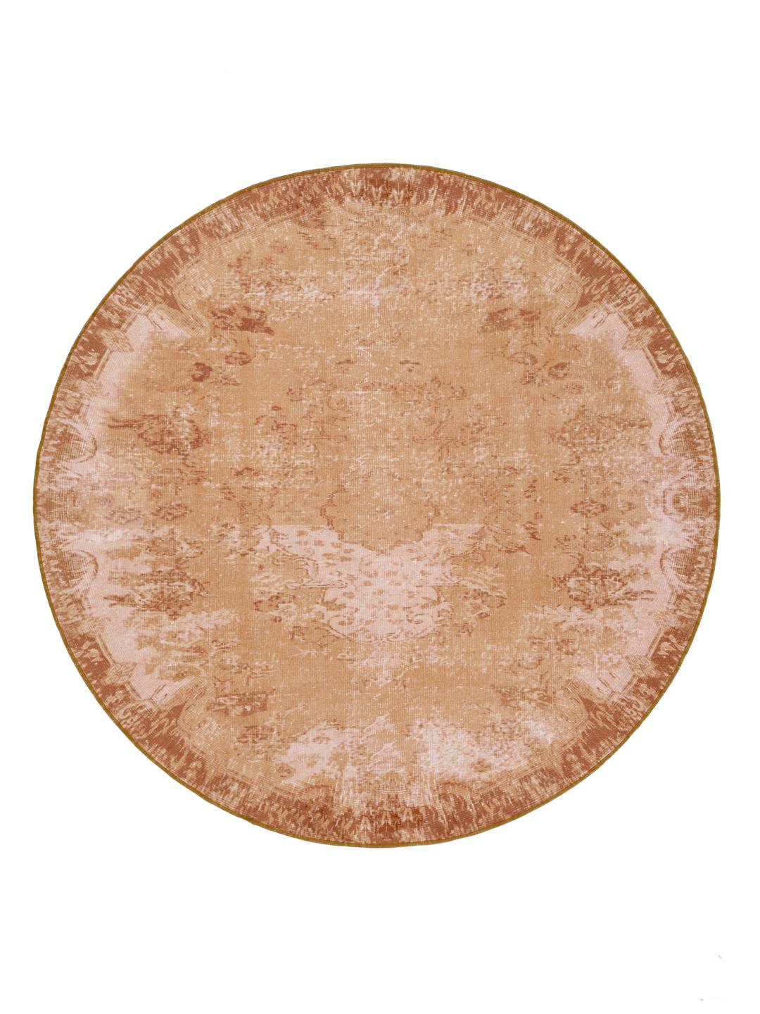 Rond goud vloerkleed met een traditioneel patroon