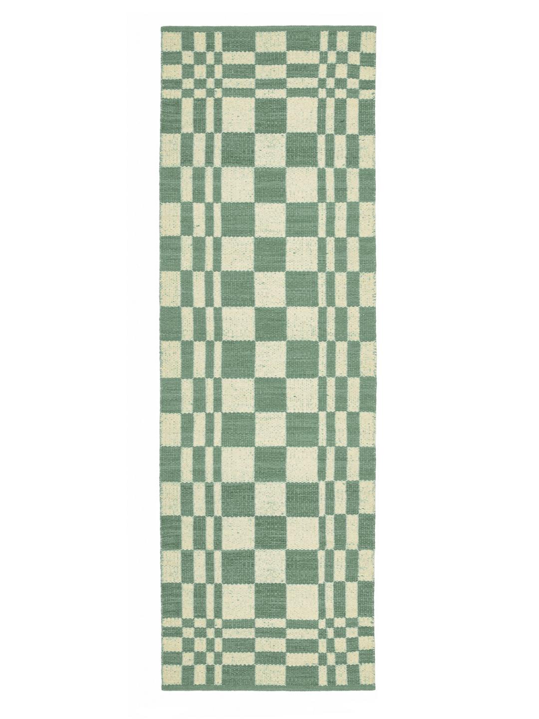 Un tapis de couloir à carreaux vert et ivoire