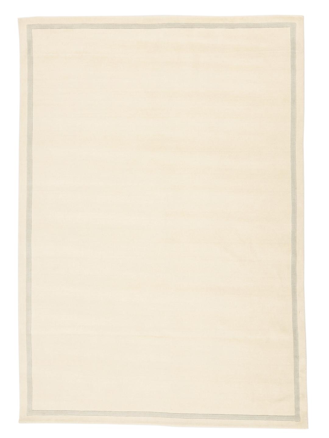 Tapis tissé à la main originaire d'Inde dans une couleur beige neutre avec une bordure subtile
