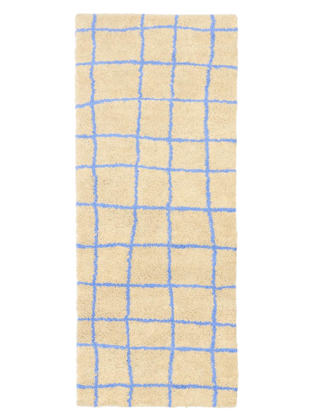 Beige og blå løbertæppe med et gittermønster