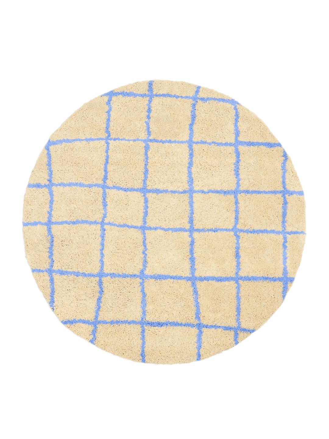 Rundt tæppe i beige og blå med mønster