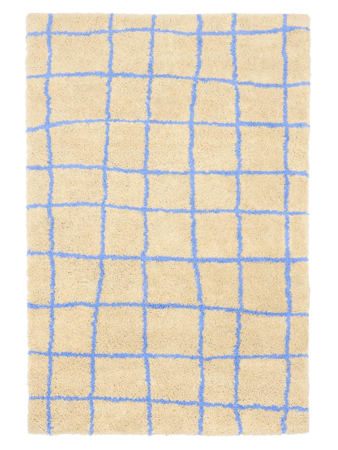 Beige og blå tæppe med et mønster af gitre