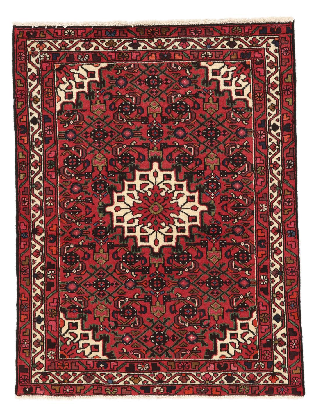 Tapis Hosseinabad noué main en provenance du Moyen-Orient, dans des tons rouge profond avec des motifs géométriques.